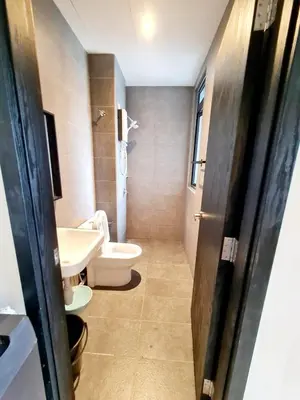 a bathroom with a toilet and a sink at Compact Studio Near Gleneagles KLCC in Kuala Lumpur