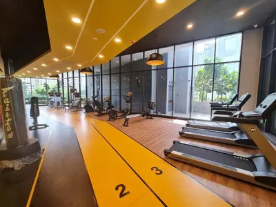 a gym with treadmills and machines in a room at Neu Suites Tiny Queen Bed Studio 10 mins to KLCC in Kuala Lumpur