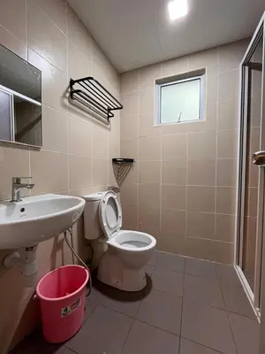 a bathroom with a toilet and a sink at Raay Home at Razak City Residence KL in Kuala Lumpur