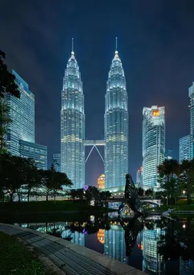 a group of tall skyscrapers in a city at night at Raay Home at Razak City Residence KL in Kuala Lumpur