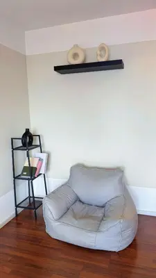 a white couch sitting in a living room at UNA Residensi Jln Peel Fully Air Con Homestay in Kuala Lumpur