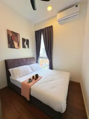 a bedroom with a bed with two cups on it at UNA Residensi Jln Peel Fully Air Con Homestay in Kuala Lumpur