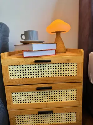 a wooden dresser with a lamp and books on it at UNA Residensi Jln Peel Fully Air Con Homestay in Kuala Lumpur