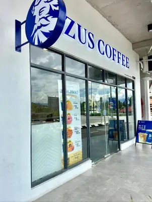 a zus coffee sign on the side of a store at Near in Kuala Lumpur