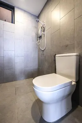 a bathroom with a white toilet in a room at M Vertica Home Plus in Kuala Lumpur