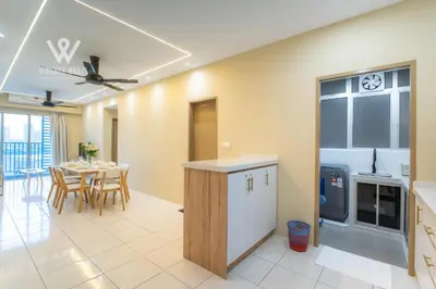 a kitchen and dining room with a table and chairs at 6 pax Modern 3BR Stay in Sentul near KL City in Kuala Lumpur