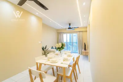 a dining room with a table and chairs at 6 pax Modern 3BR Stay in Sentul near KL City in Kuala Lumpur