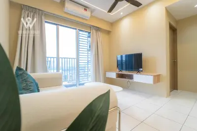 a living room with a couch and a tv at 6 pax Modern 3BR Stay in Sentul near KL City in Kuala Lumpur