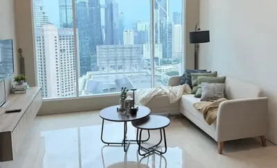 a living room with a couch and a table at Soho Suites KLCC by City Keys in Kuala Lumpur