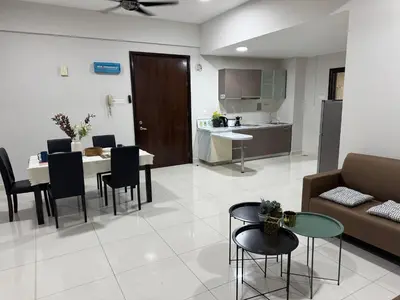 a living room with a couch and a table at Regalia KLCC Pavilion Ceylon Jalan Alor 8 PAX 2R2B in Kuala Lumpur