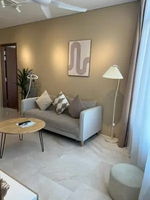 a living room with a couch and a table at Skysuites Twin Tower Prime Location in Kuala Lumpur