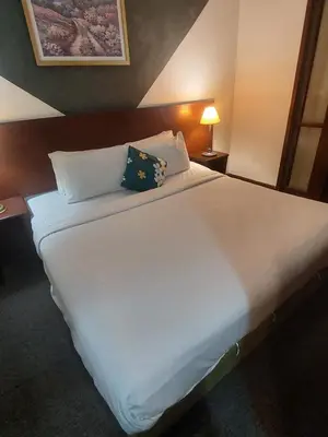 a large white bed in a hotel room at kl Dreamx service suite at times square in Kuala Lumpur