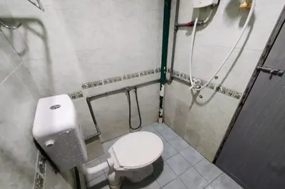 a bathroom with a toilet and a shower at 98 Inn BilikXpert at Chow Kit in Kuala Lumpur