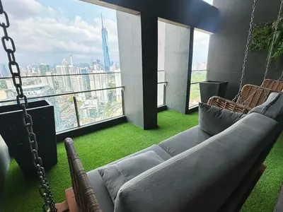 a living room with a couch and a swing at KL Sentral Monorail 4 pax Kuala Lumpur, Sky Pool Family Merdeka 118 Nice View in Kuala Lumpur