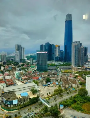a city skyline with tall buildings and a street at Taragon Putri Bintang in Kuala Lumpur