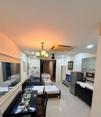 a living room with a couch and a table at Taragon Putri Bintang in Kuala Lumpur