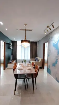 a living room with a table and a couch at Kuala Lumpur Sky Suites KLCC in Kuala Lumpur