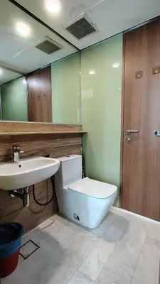 a bathroom with a toilet and a sink at Kuala Lumpur Sky Suites KLCC in Kuala Lumpur