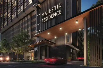 a red car parked in front of a building at Majestic Residence Suites KLCC by Homebrickz in Kuala Lumpur