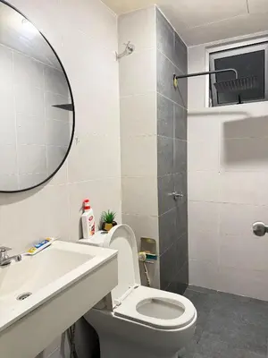 a bathroom with a toilet and a sink and a mirror at RSJ Homestay at Setapak - 2 Room in Kuala Lumpur