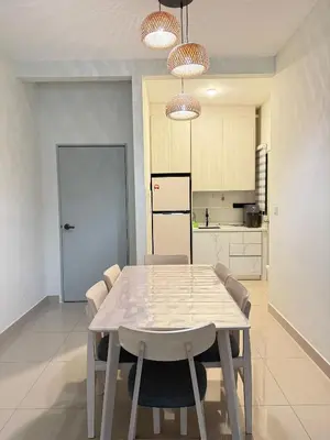 a dining room table and chairs in a kitchen at RSJ Homestay at Setapak - 2 Room in Kuala Lumpur