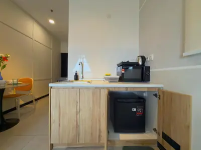 a kitchen with a counter with a microwave on it at Neu Suites by Serenity Luxe Suites in Kuala Lumpur