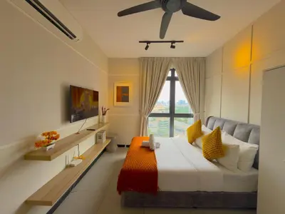 a bedroom with a bed and a ceiling fan at Neu Suites by Serenity Luxe Suites in Kuala Lumpur