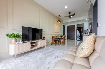 a living room with a couch and a flat screen tv at SV001 Maluri - Sunway Velocity - Cheras Stay in Kuala Lumpur