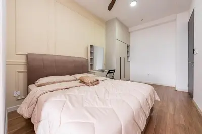 a bedroom with a large white bed with a headboard at SV001 Maluri - Sunway Velocity - Cheras Stay in Kuala Lumpur