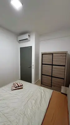 a bedroom with a bed with two towels on it at M Arisa Sentul City View Condo in Kuala Lumpur