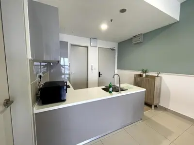 a kitchen with a sink and a counter top at Trion KL SkyLoft in Kuala Lumpur