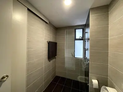 a bathroom with a shower with a glass door at Trion KL SkyLoft in Kuala Lumpur