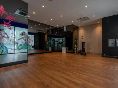a room with a wooden floor and a large wall at Star KLCC Comfort Suite 3-4pax in Kuala Lumpur