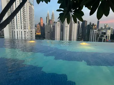 a swimming pool with a view of a city at KLCC View Serviced Apartment at Majestic Residence Kuala Lumpur in Kuala Lumpur