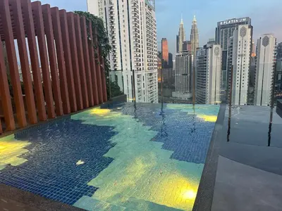 a view of a city from the roof of a building at KLCC View Serviced Apartment at Majestic Residence Kuala Lumpur in Kuala Lumpur