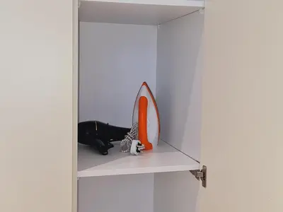 a shelf with a mirror and a pair of shoes at KLCC View City Center At Majestic residence in Kuala Lumpur