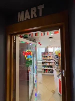 a mart entrance to a store with a mart refrigerator at Vortex Suites KLCC By GuestHouse in Kuala Lumpur