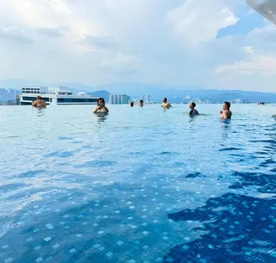 a group of people swimming in a swimming pool at Dorsett Serviced Suites Kuala Lumpur By NP in Kuala Lumpur