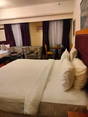 a large white bed in a hotel room at Glacier suite at times square kl in Kuala Lumpur