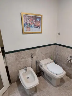 a bathroom with a toilet and a bidet at KL Heart Suite at berjaya Times Square in Kuala Lumpur
