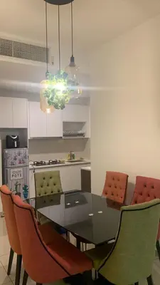 a kitchen with a dining room table and chairs at Cozy Stay at Legasi 5 min Walking distance to KLCC 2 in Kuala Lumpur
