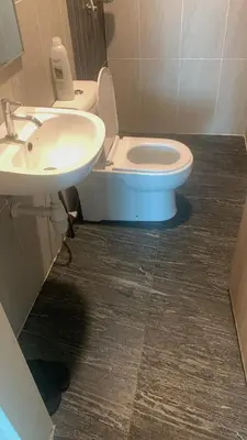 a bathroom with a white toilet and a sink at Cozy Stay at Legasi 5 min Walking distance to KLCC 2 in Kuala Lumpur