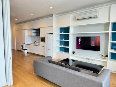 a living room with a couch and a flat screen tv at The Platinum KLCC By Elegant Suites in Kuala Lumpur