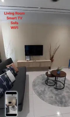a living room with a couch and a table at Datum Jelatek SKY Ring in Kuala Lumpur
