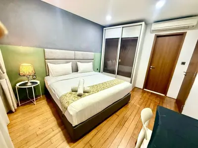 a bedroom with a king sized bed in a room at Vortex Suites Klcc By Bukit Bintang in Kuala Lumpur