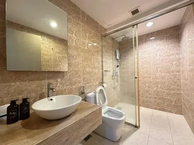 a bathroom with a sink and a toilet and a shower at Bintang Fairlane Residence, 1 Min to Pavilion KL, Spacious Fam Suite 2B2R in Kuala Lumpur