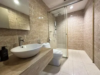 a bathroom with a sink and a toilet and a shower at Bintang Fairlane Residence, 1 Min to Pavilion KL, Spacious Fam Suite 2B2R in Kuala Lumpur