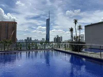 a large swimming pool on top of a building with a city at Bintang Fairlane Residence, 1 Min to Pavilion KL, Spacious Fam Suite 2B2R in Kuala Lumpur
