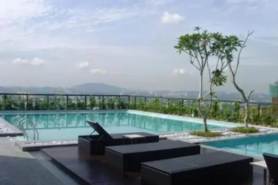 a swimming pool with a view of a building at Bintang Fairlane Residence, 1 Min to Pavilion KL, Spacious Fam Suite 2B2R in Kuala Lumpur