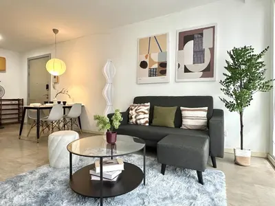 a living room with a couch and a table at Bintang Fairlane Residence, 1 Min to Pavilion KL, Spacious Fam Suite 2B2R in Kuala Lumpur